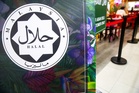 Penang council cracks down on burger stall over halal stickers that sparked segregation claims