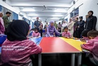 Queen visits Chow Kit school for vulnerable children and presents RM30,000 contribution