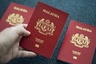 Govt to use up existing passport, MyKad stocks before switch to new supply contract, says home minister