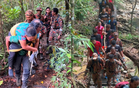 Terengganu firefighters rescue injured climber after six-hour trek through rain and steep terrain at Gunung Chemerong