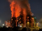 Hong Kong charges seven, two companies over deadly 168-victim residential fire