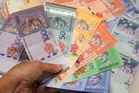 Ringgit eases at open as Fed’s hawkish tone supports US dollar