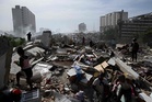 Venezuelan mother claws through quake rubble in desperate search for trapped son