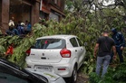 Building collapse kills six in Mumbai as torrential rain batters city