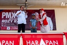 Anwar touched by boy’s plantation journey to meet him in Segamat, gifts bicycle after visit