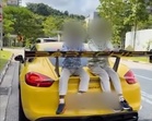 Singapore father receives S$5,000 fine, six-month ban for driving with sons on Porsche boot