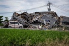 Race against heat after Japan quake leaves 30 dead and thousands without utilities