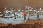 Singapore issues warnings, bars Massive Attack duo from re‑entering after Palestinian flag display at concert