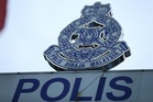 Machete-wielding man allegedly strikes car in high-beam dispute near Senai airport, two arrested