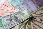 Ringgit eases versus US dollar, ends higher against other major currencies