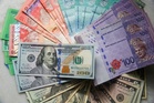 Ringgit firms against dollar as weak US data rattles markets