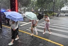 Typhoon Dolphin weakens but leaves hundreds of flights cancelled and flood alerts across China