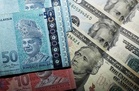 Ringgit rises against US dollar as markets await 2Q GDP, US inflation data