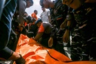 Rescuers scour Bali waters for five missing after ferry fire sends dozens scrambling overboard