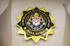 Four, including ex‑native affairs officer and civil servant, held in Keningau over RM900,000 land‑sale bribery case
