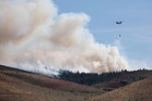 Fast-moving wildfire threatens Reno as tens of thousands ordered to flee