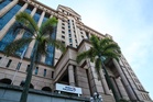 Bursa Malaysia ends flat as investors await earnings for direction