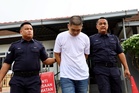 Kluang used car dealer claims trial over illegal possession of Smith & Wesson pistol
