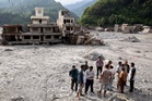 Rescuers dig into tunnel as missing toll from Nepal, China flood tops 3,000