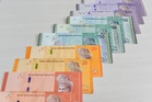 Ringgit opens slightly higher against dollar ahead of key US CPI