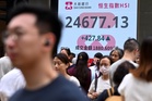 Asian stocks tumble as oil tops US$100, reviving rate hike fears