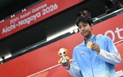 Chinese swimmer bags seven golds in Asian Games first; N. Korea lifters break more world records