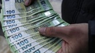 Euro slides as concerns about French debt mount