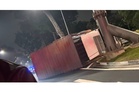Singapore cops arrest driver after lorry overturns and crashes into height limit sign in Bukit Timah