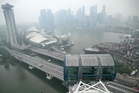 Afternoon showers bring brief haze relief to Singapore, but air quality remains unhealthy