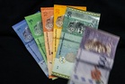 Ringgit slips against US dollar as investors await inflation data