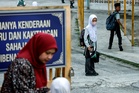 MOE reverts to haze plan: Schools shut at API 200, outdoor classes at 100, parents may keep kids home