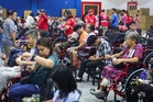 PRC distributes 55 wheelchairs in Mandaluyong