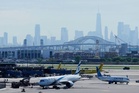 Passenger jet clips lamppost, truck while landing at Newark