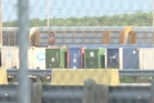 Heat stroke is suspected among 6 found dead in a shipping container at a rail yard near Texas border