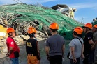 Rescuers search for 20 missing after Philippine building collapse