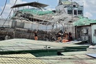 'Signs of life' detected under rubble of collapsed building as search for survivors continues
