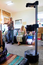 A robot is helping an ailing couple stay in their home. Are more to come for an aging population?