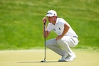 Poston fires 65 to seize one-stroke lead
