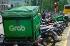 Grab takes lead in landmark govt deal to slash gig worker costs and guarantee minimum rates