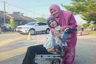 Cerebral palsy bukan penghalang Bella tunaikan tanggungjawab mengundi