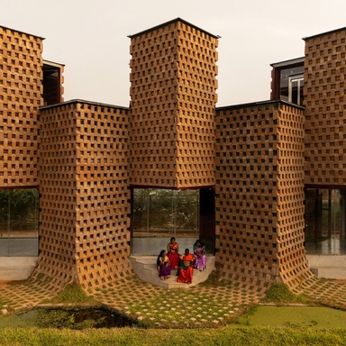 Mud-coated shipping containers form Petti restaurant in India by Wallmakers