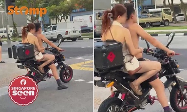 Shirtless man and female passenger turn heads riding e-bike without helmets at Towner Road