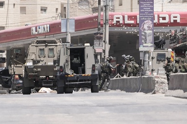 Israel's military said a Palestinian family could bury their father. Then the settlers arrived