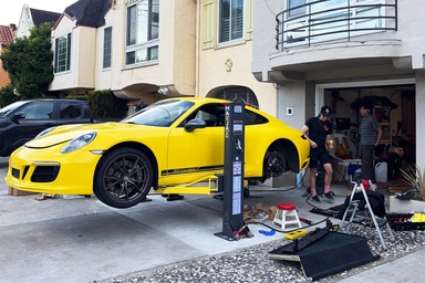 Disappearing Driveway Lift Setup in the Middle of the City Is a Genius Home Mechanic Move