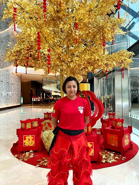 Image from: Siti Saleha The Head Of The Lion For CNY Performances Is One Malay Girl With True Grit. #CNY2023 
