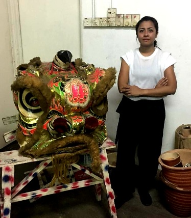 Image from: Siti Saleha The Head Of The Lion For CNY Performances Is One Malay Girl With True Grit. #CNY2023 