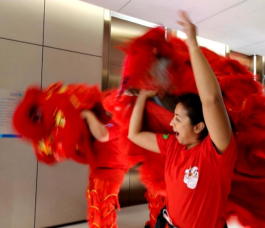 Image from: Siti Saleha The Head Of The Lion For CNY Performances Is One Malay Girl With True Grit. #CNY2023 