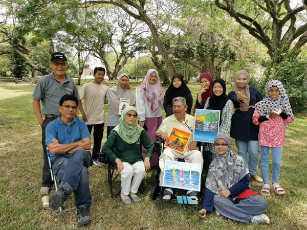 Image from: Deen an OKU once charged to be certified as one, now out on his motorised wheelchair teaching art #TheGoodOKU