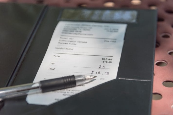 Tipping before or after tax