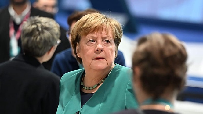 EU honours Merkel as her legacy on migration, Russia remains deeply divisive
